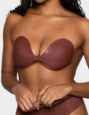 woman wearing brown front clasp sticky bra