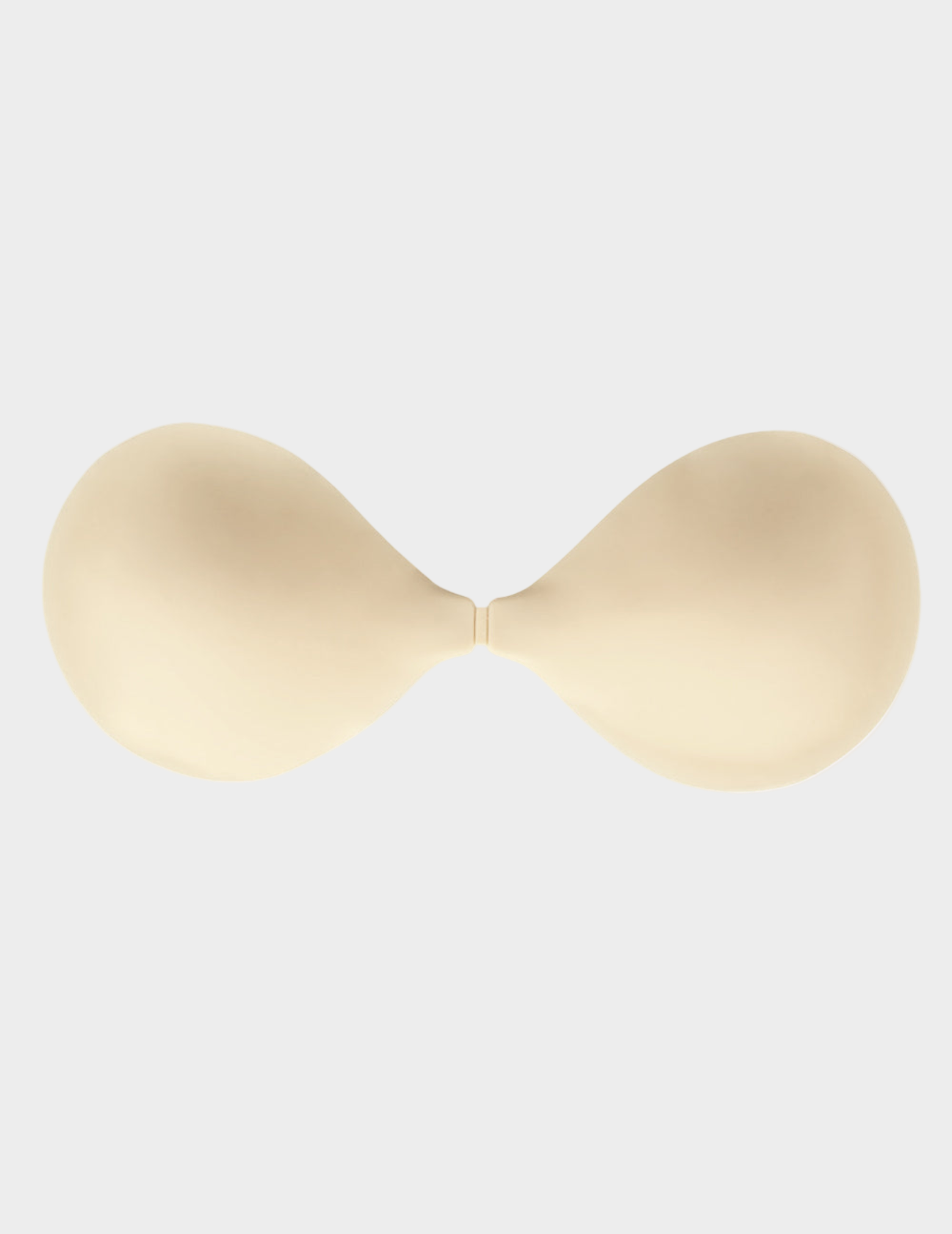 beige backless front close sticky bra on white background