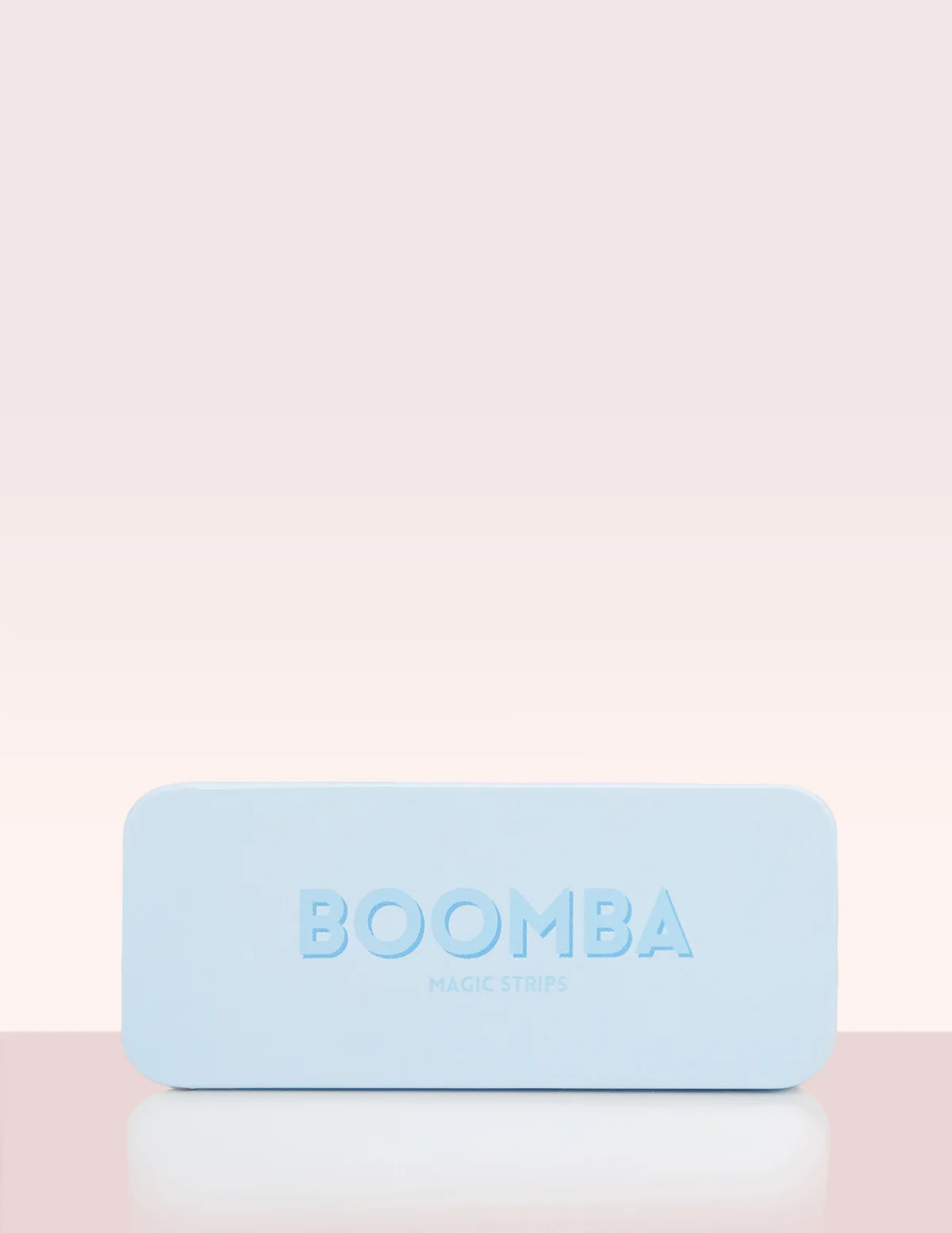 Boomba magic strips tin on pink backdrop