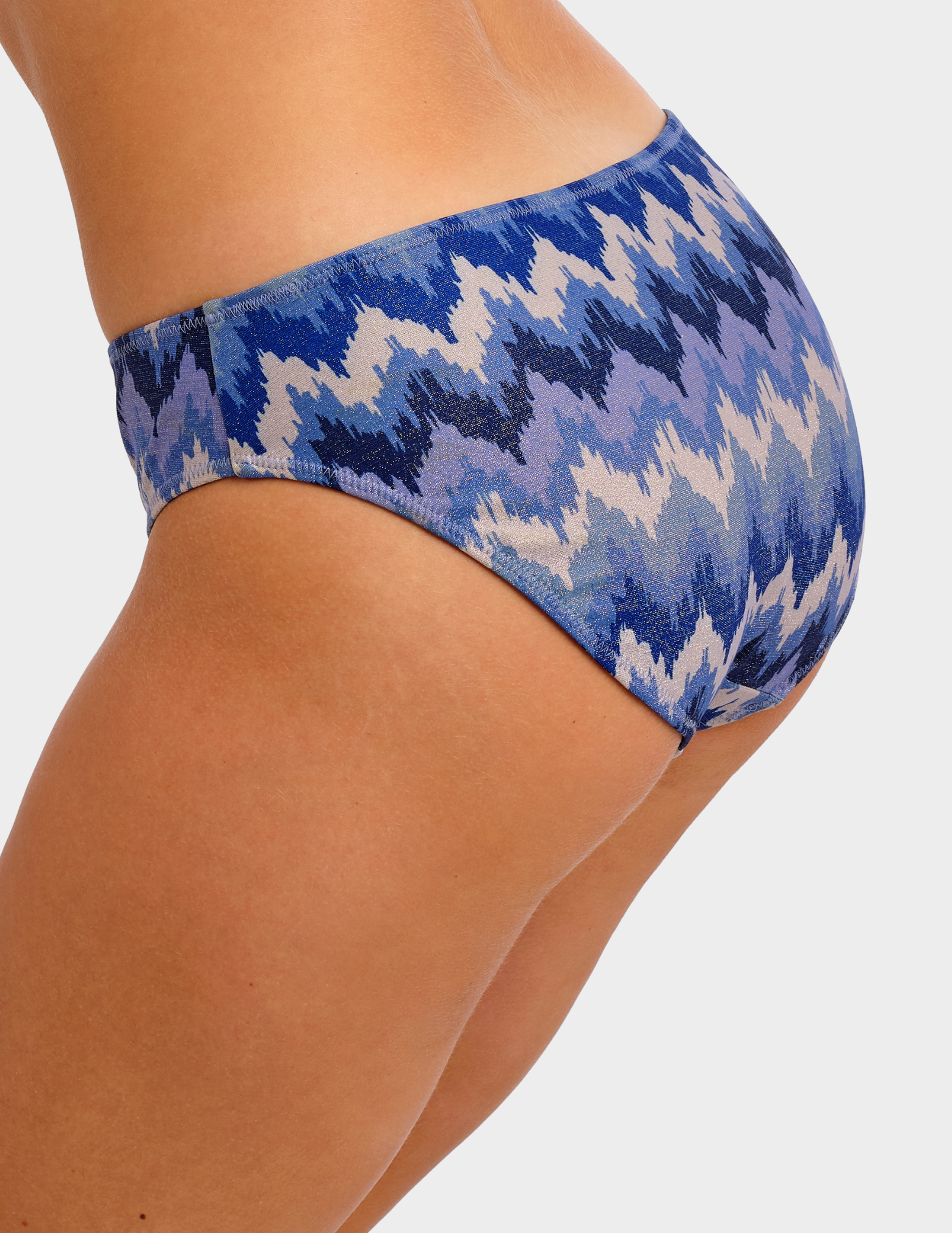 Side view of a model wearing Freya Arizona Wave swim brief in Coastline