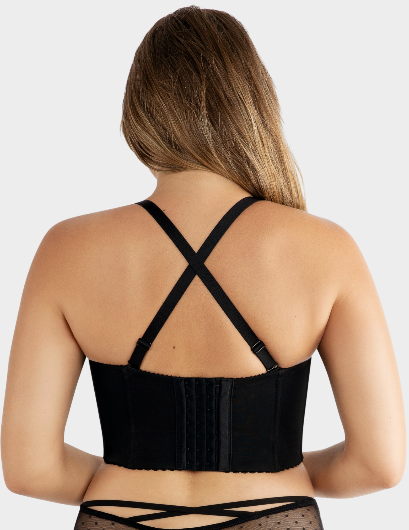 Back view of a model wearing Parfait Stevie bustier bra in black with straps crossed