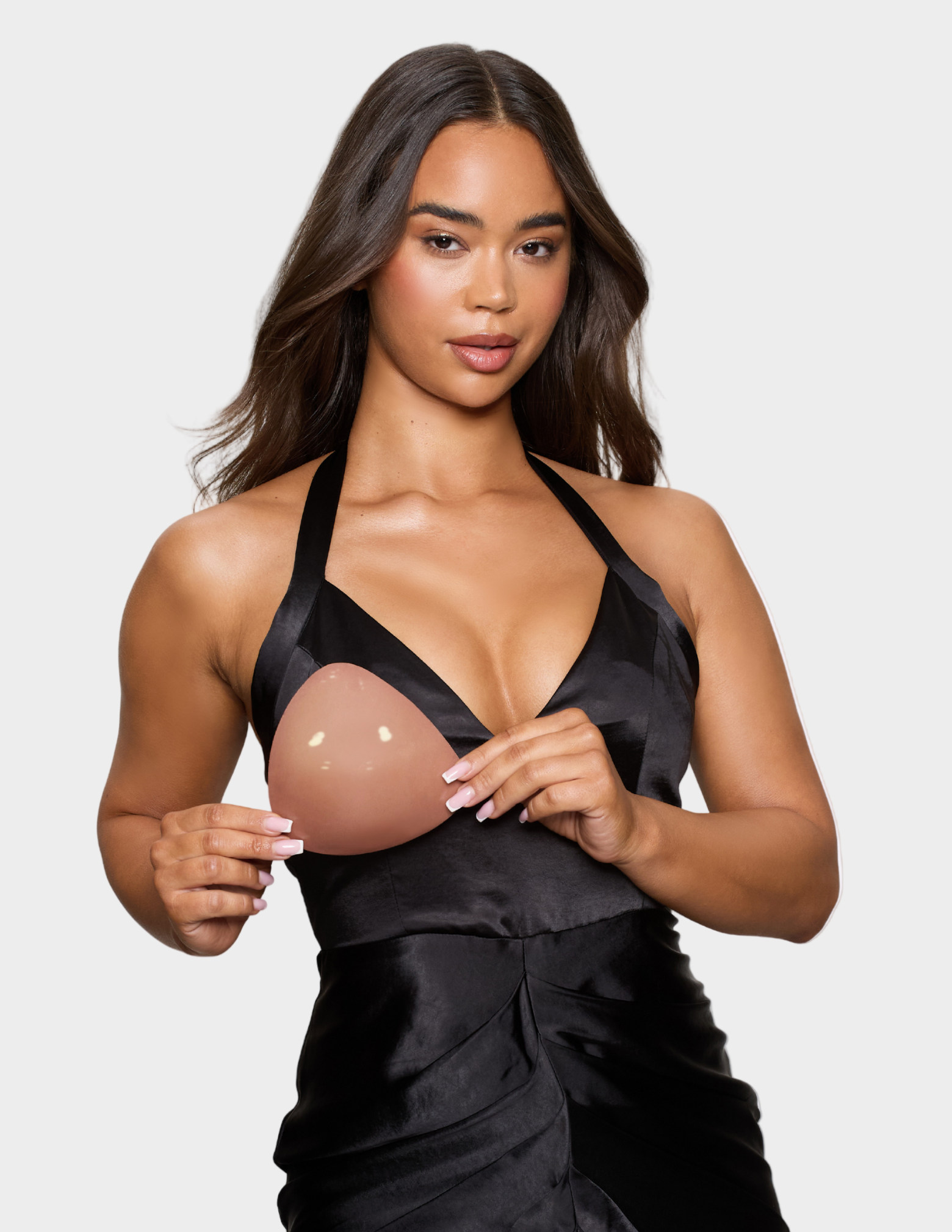 woman holding tan colored ultra boost insert