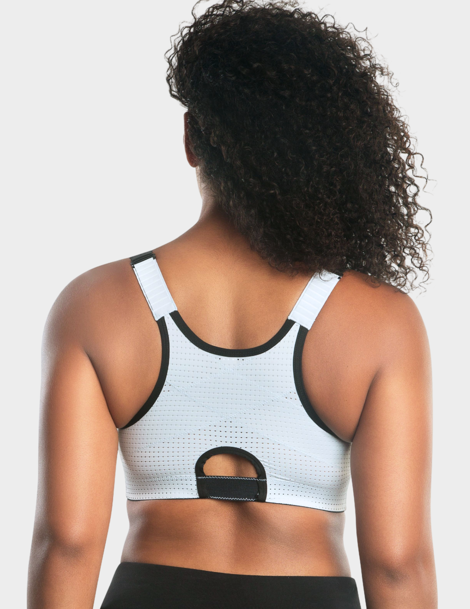 Back view of a model wearing Parfait Wave sports bra in Silver