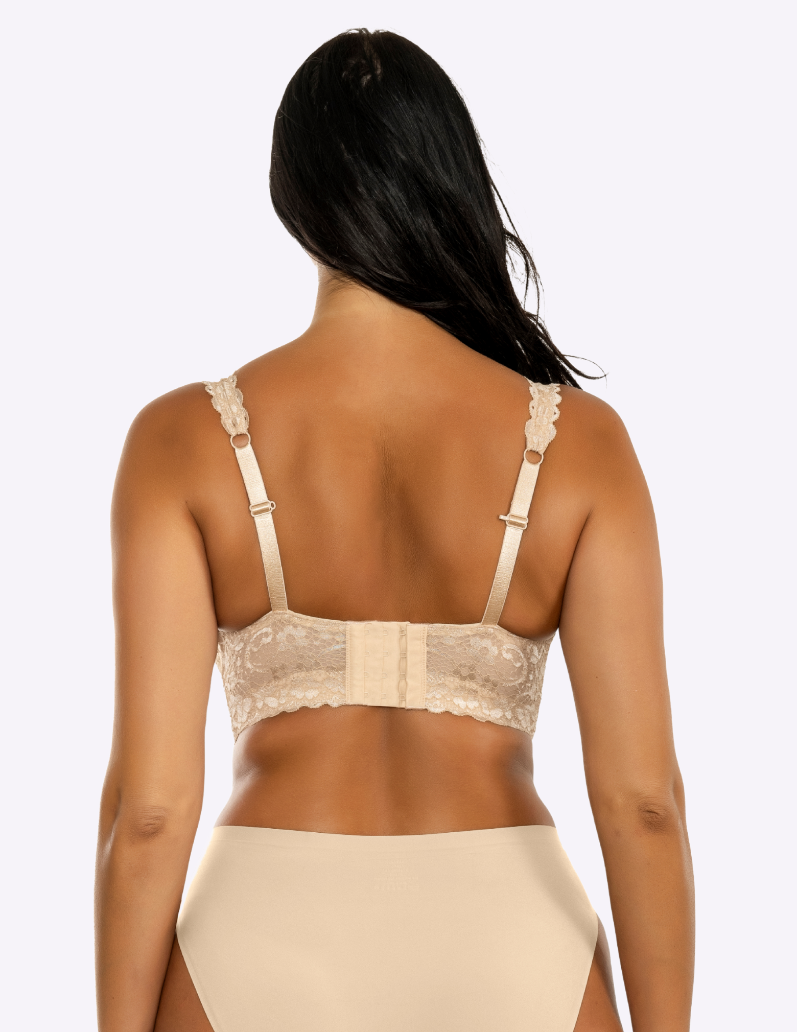 Back view of a model wearing beige Adriana lace bralette