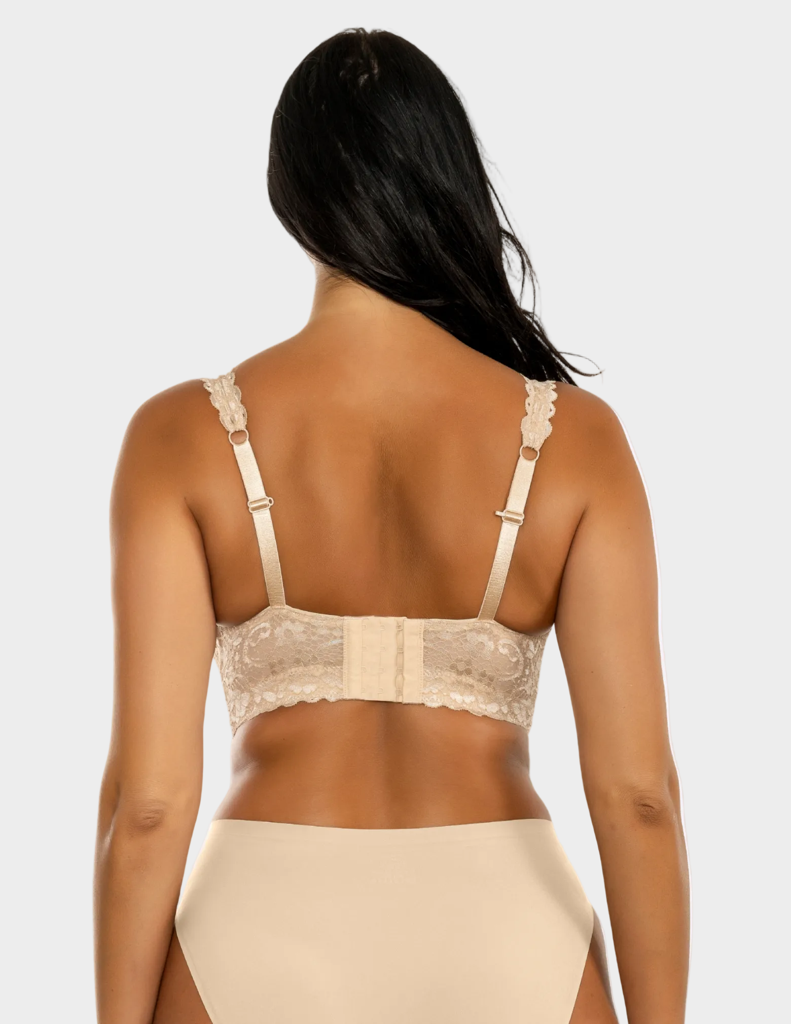 Back view of a model wearing beige Adriana lace bralette