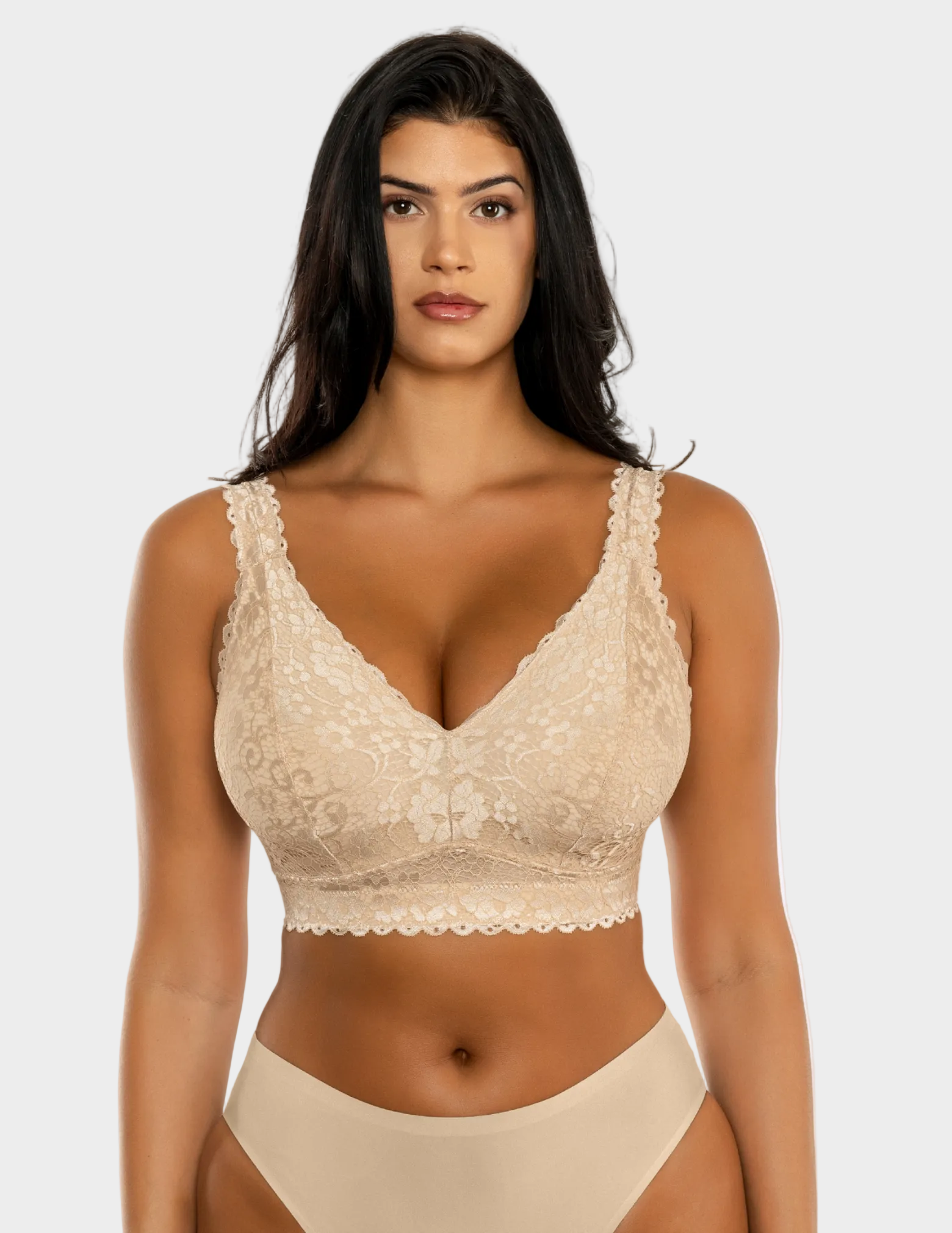 Front view of a model wearing beige Adriana lace bralette