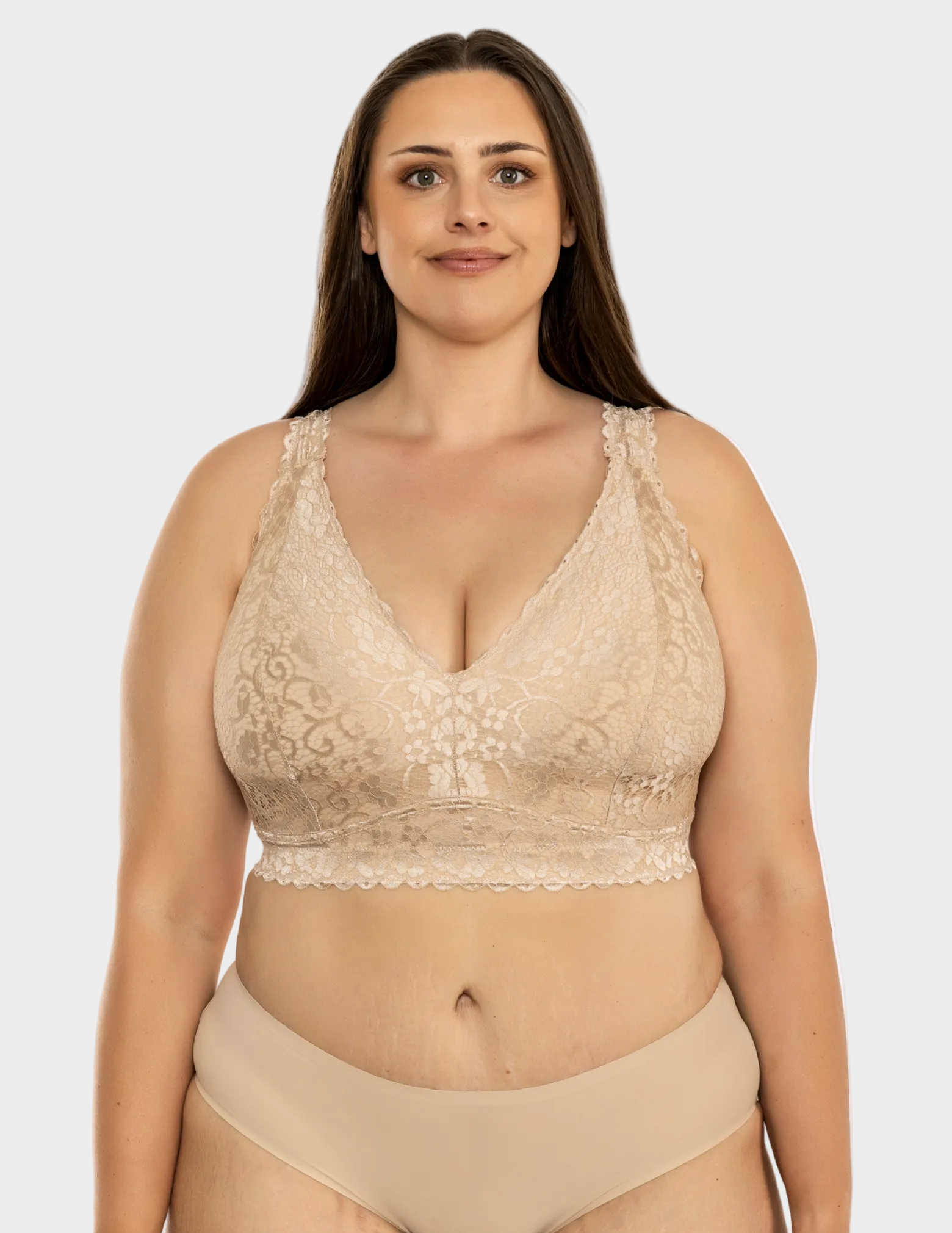 Front view of a curvy model wearing beige Adriana lace bralette
