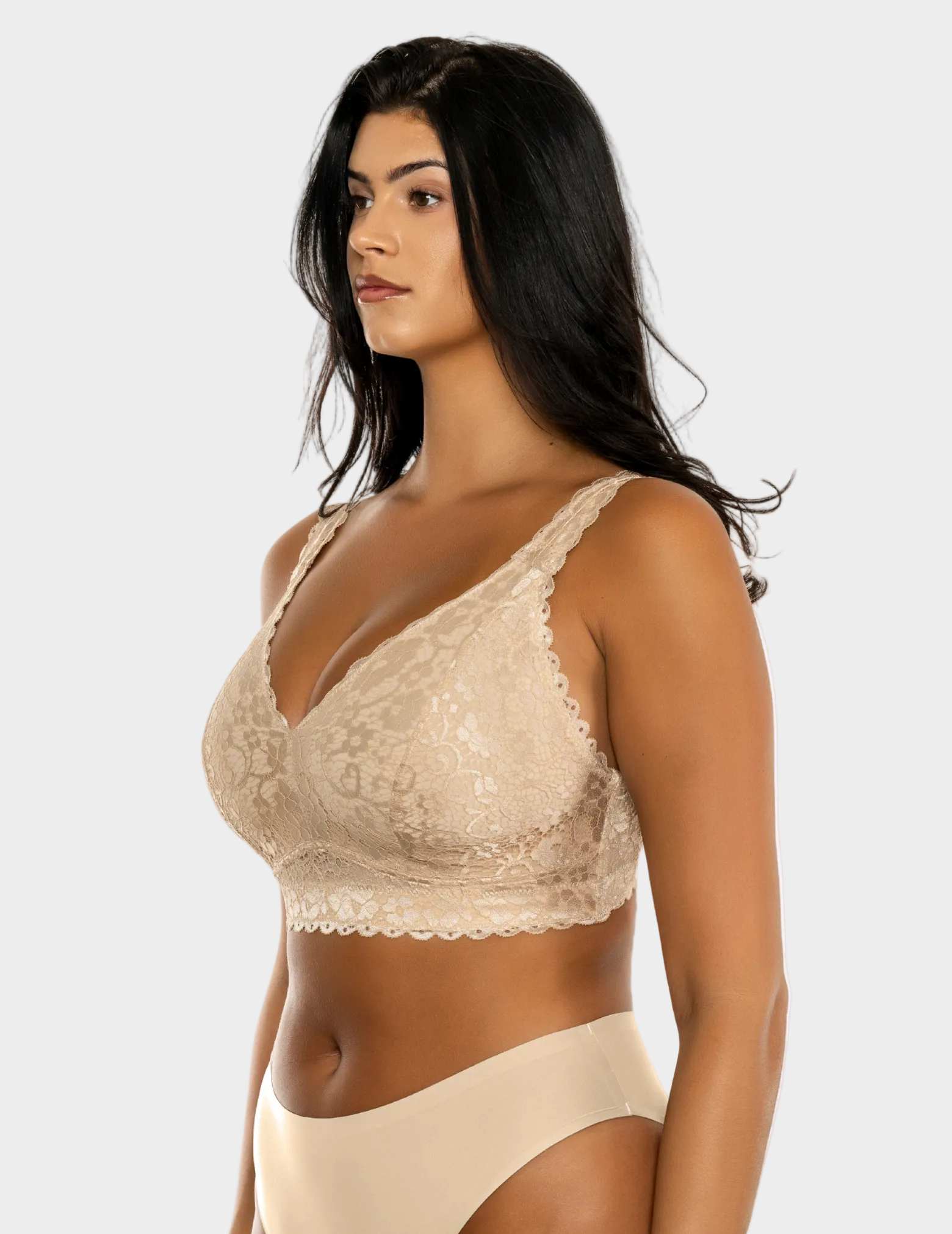Side view of a model wearing beige Adriana lace bralette