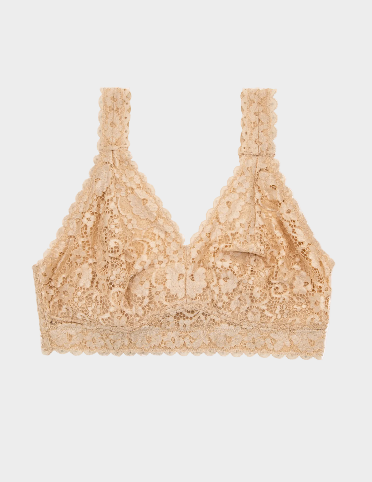 flat lay of beige Adriana lace bralette on a white background