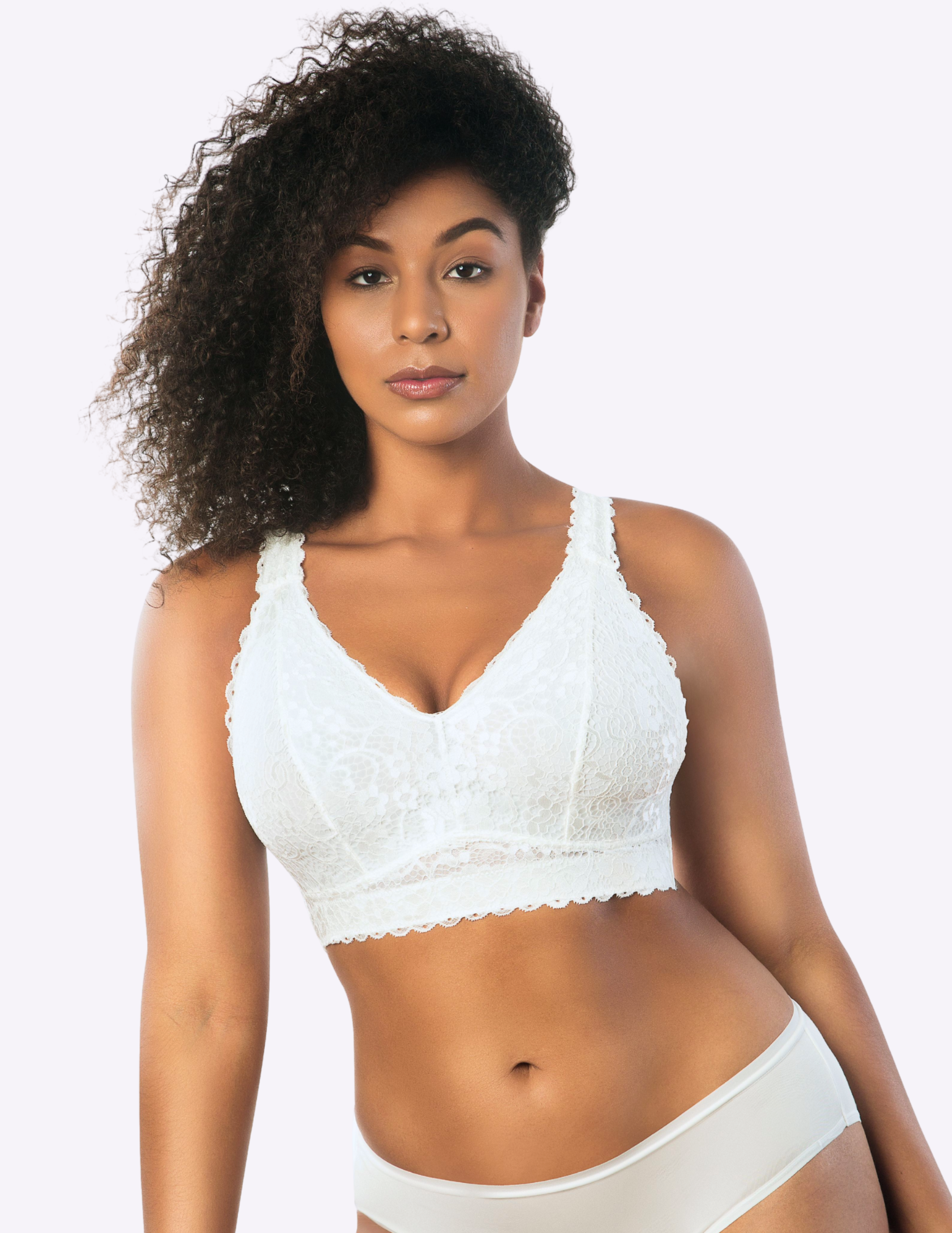 Front view of a model wearing white Adriana lace bralette