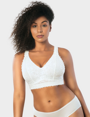 Front view of a model wearing white Adriana lace bralette