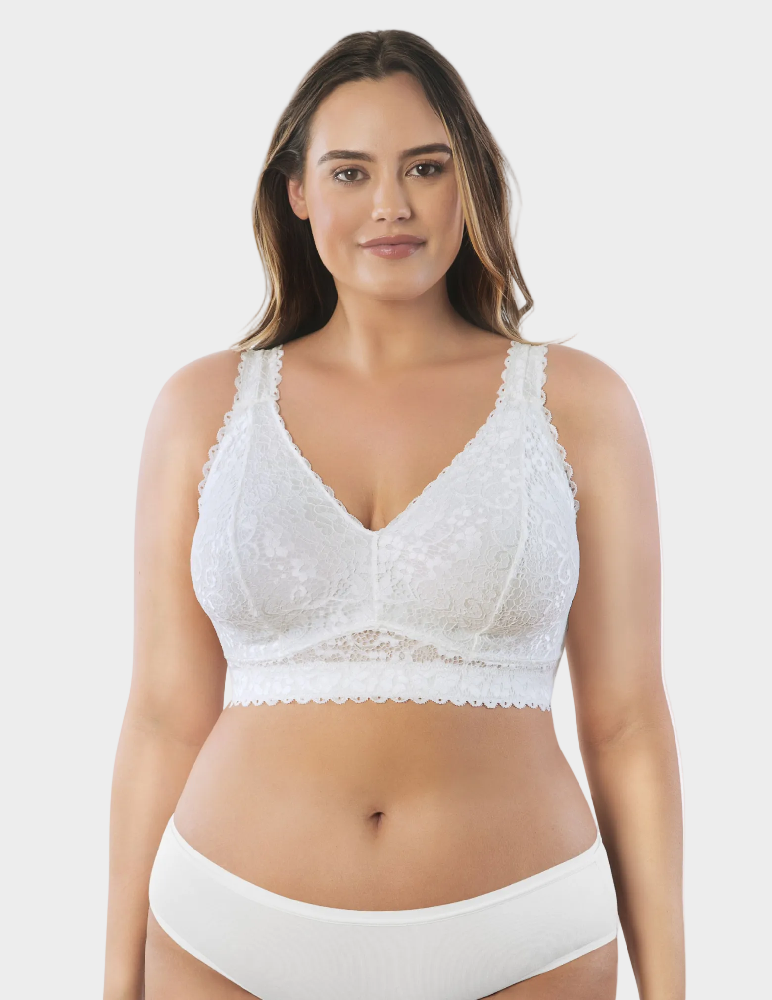 Front view of a curvy model wearing white Adriana lace bralette