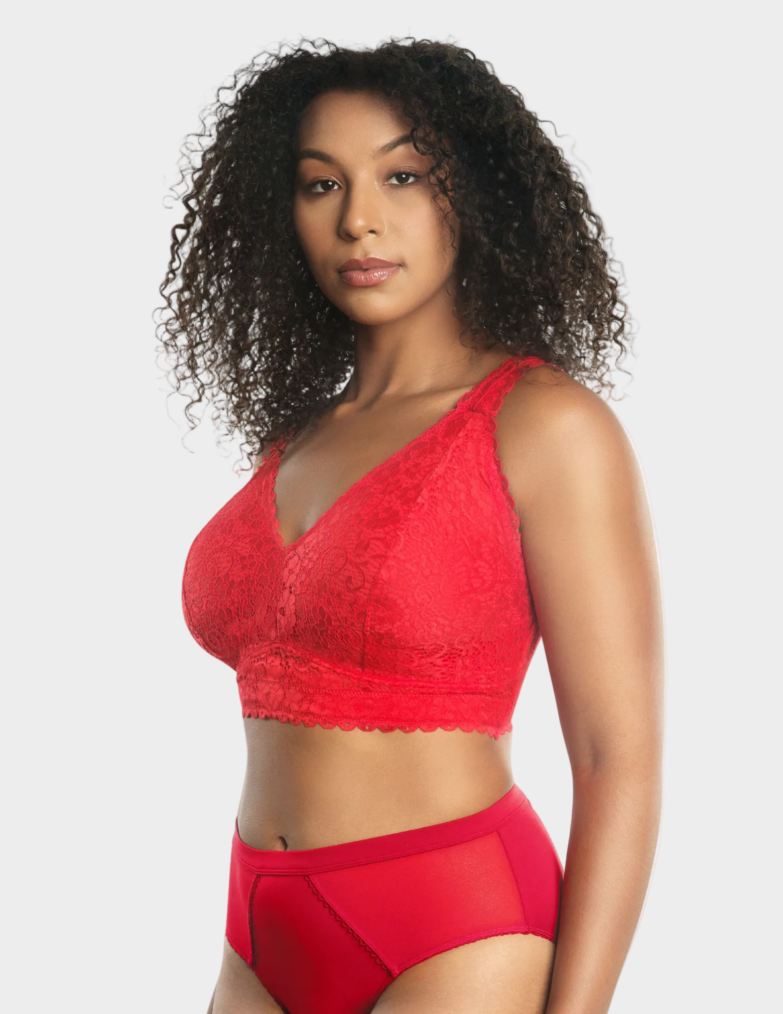 Side view of a model wearing red Adriana lace bralette