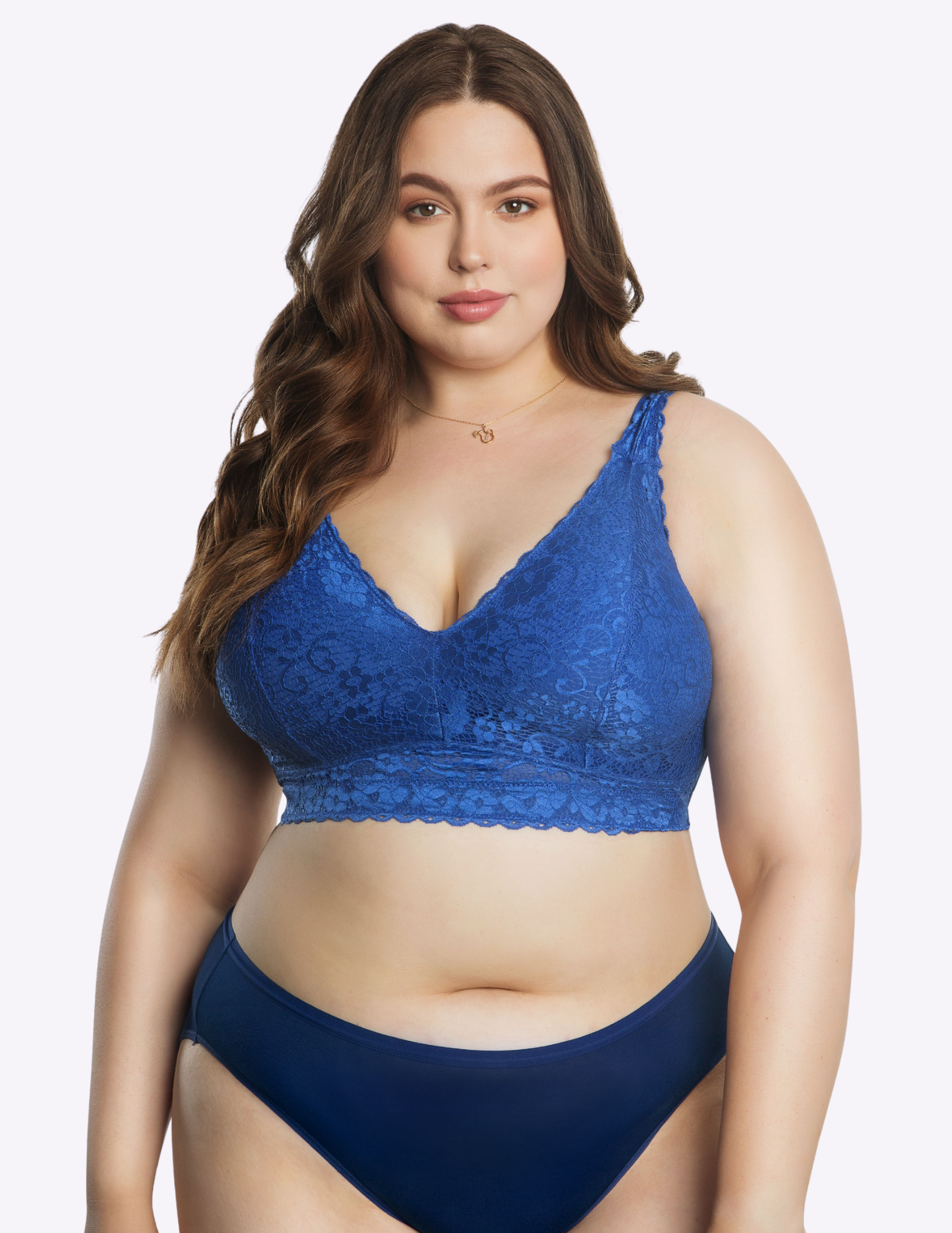 Front view of a curvy model wearing blue Adriana lace bralette