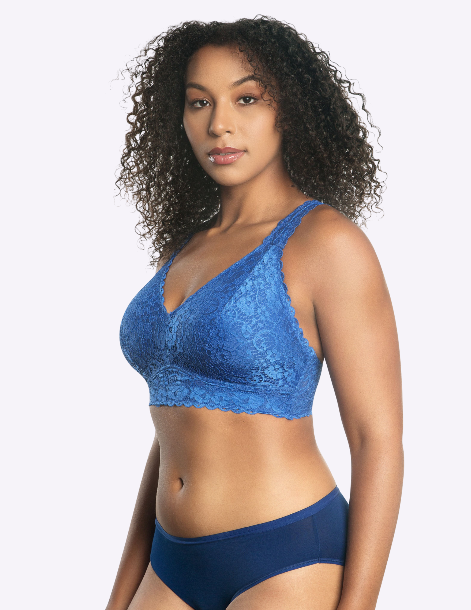 Side view of a model wearing blue Adriana lace bralette