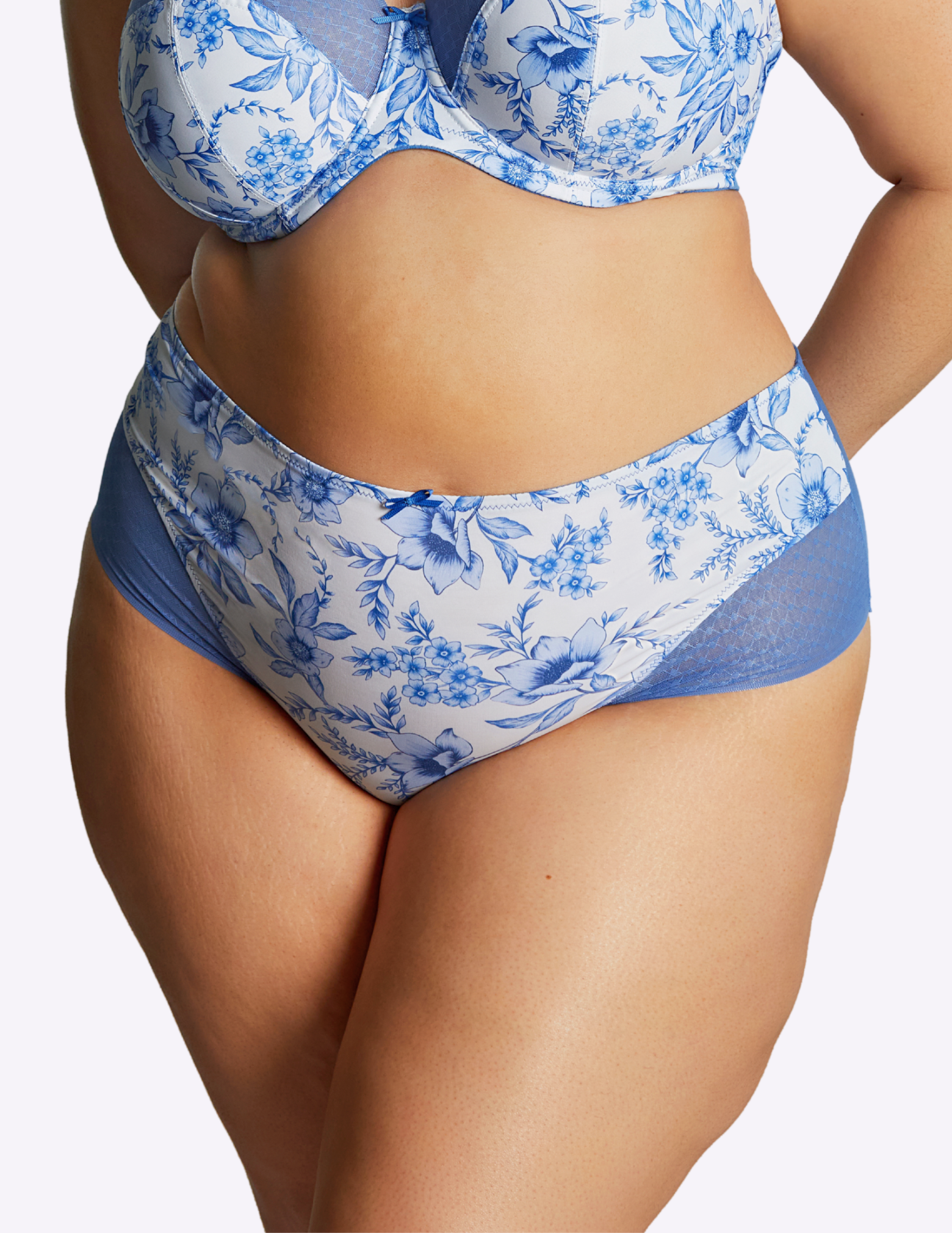 front view of model wearing bliss brief in blue floral