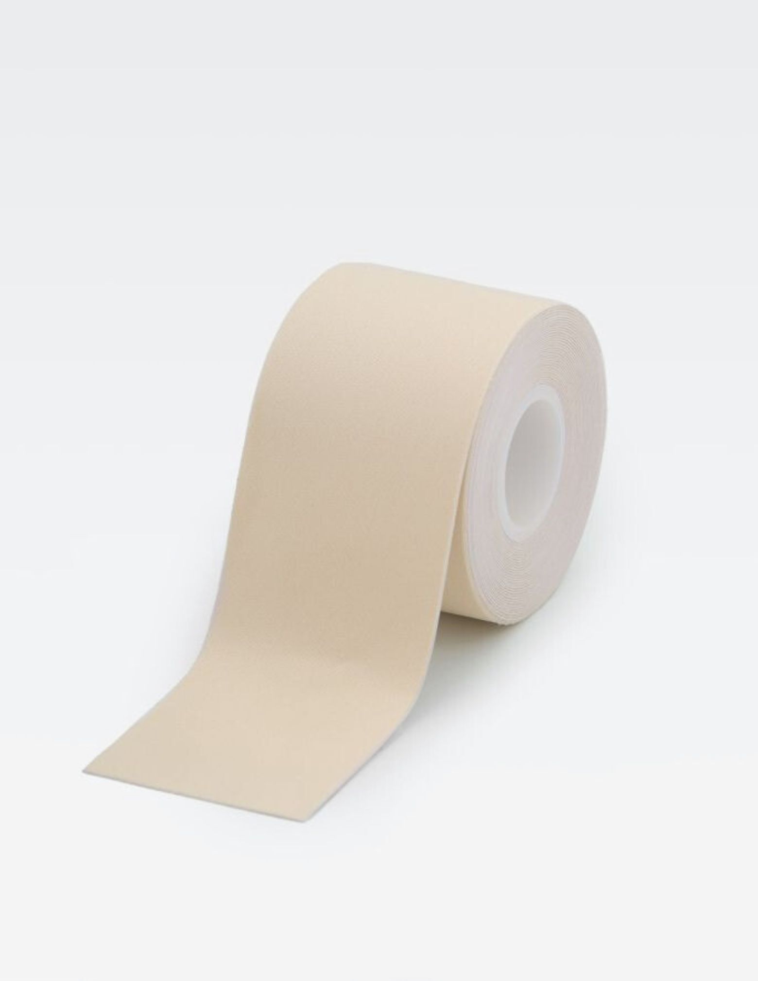 roll of light beige body tape on white background