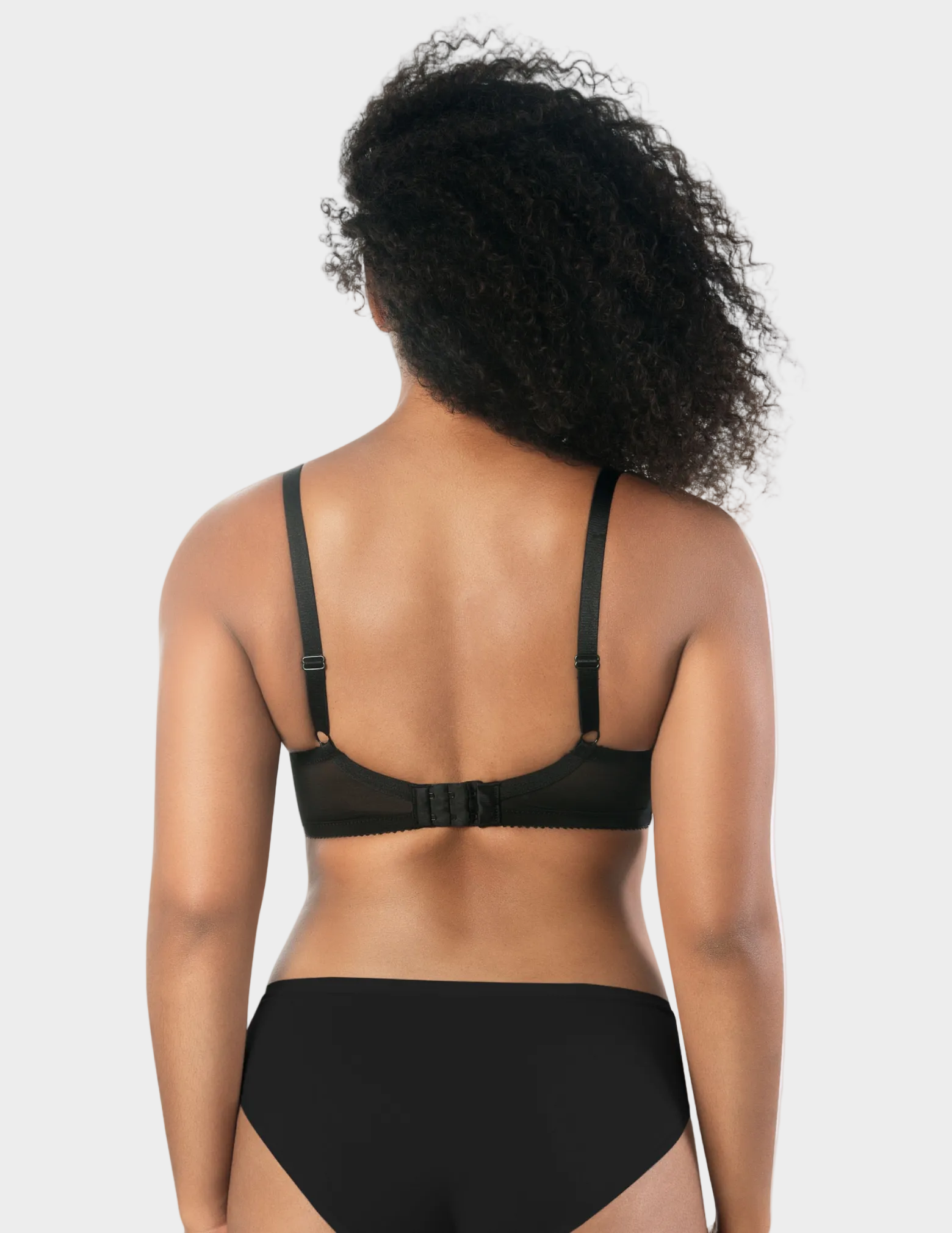 Back view of a model wearing Casey plunge t-shirt bra in Black 
