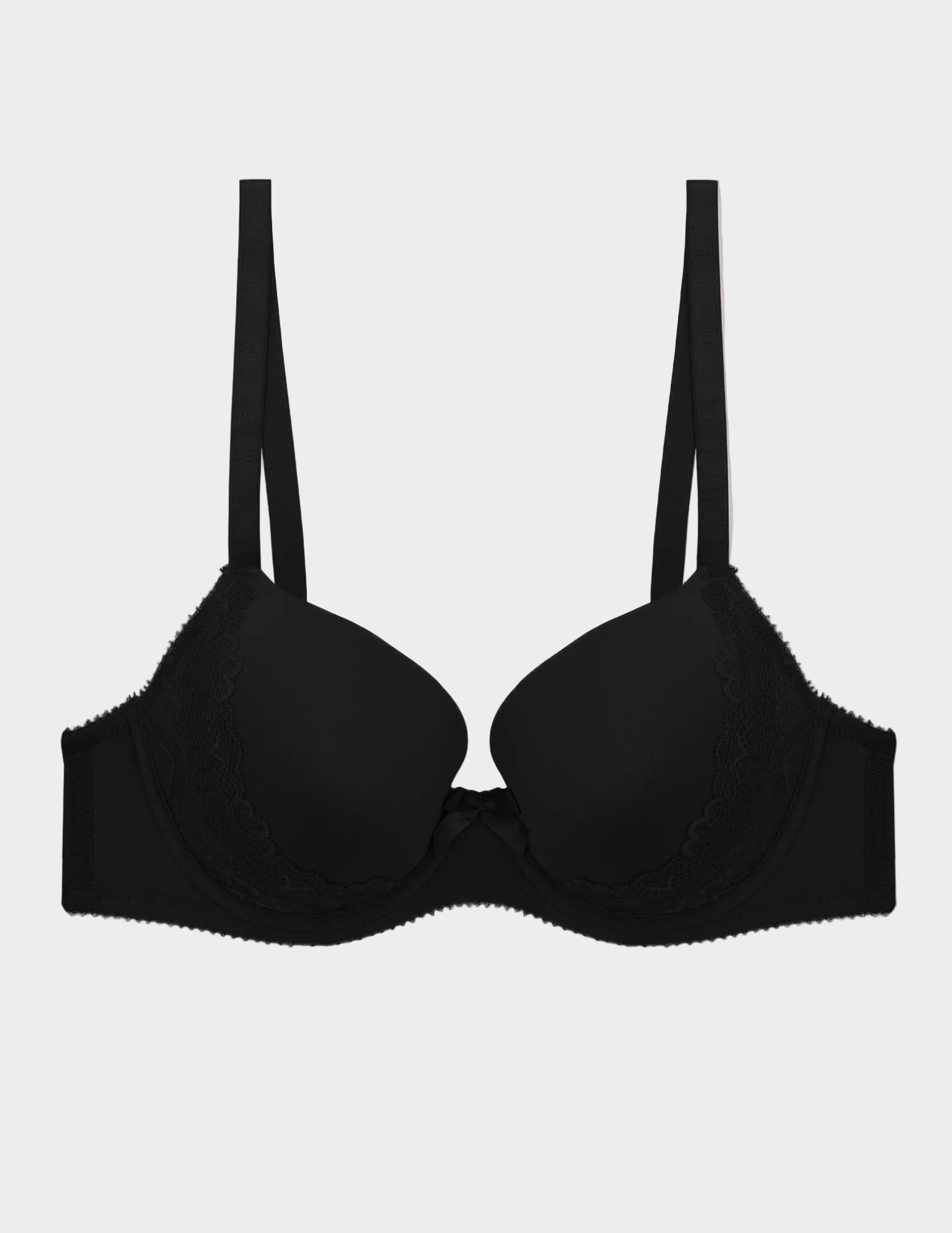 black molded plunge bra with lace side details and center front bow lying flat on a white background