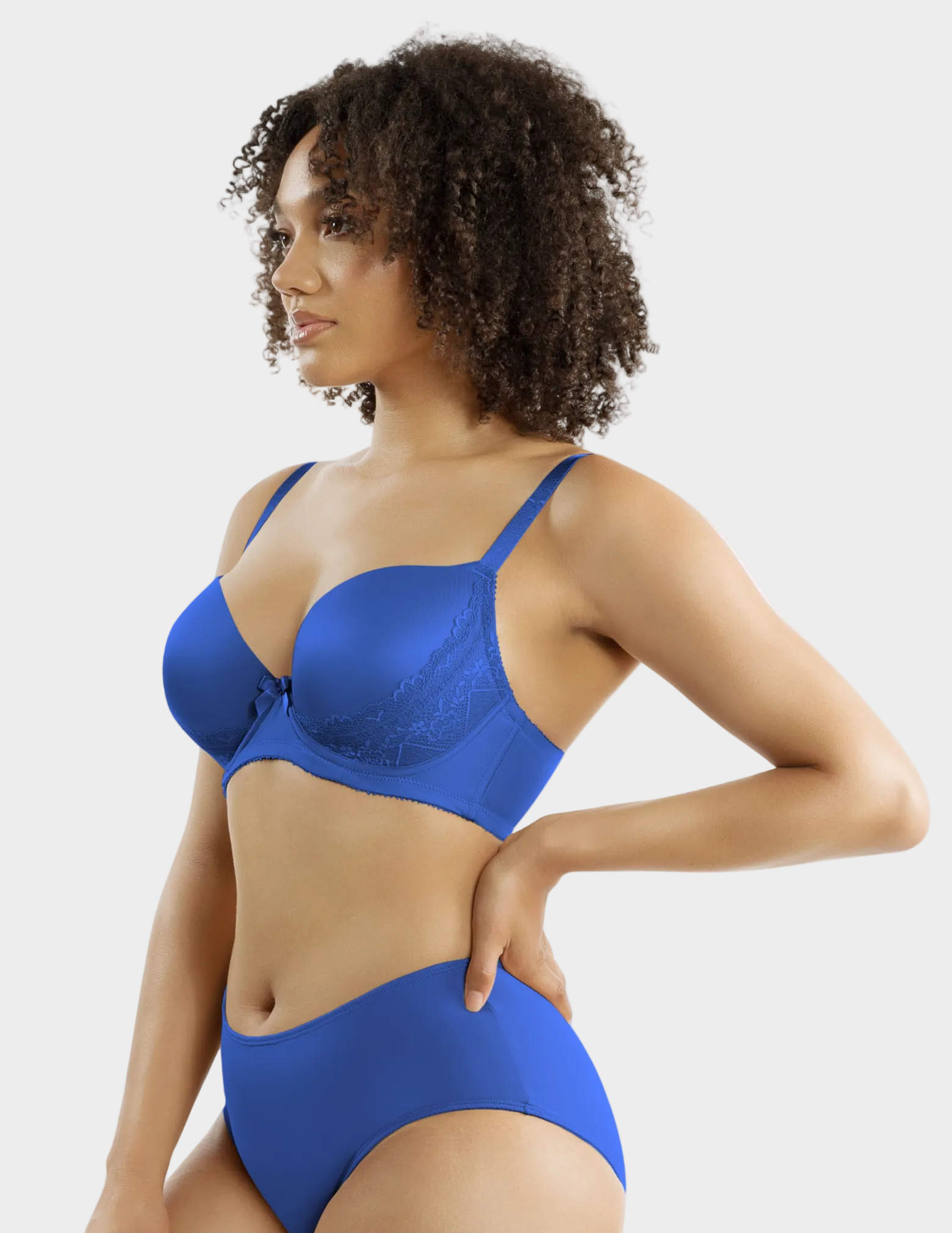 Side view of a model wearing Casey plunge t-shirt bra in Nautical Blue