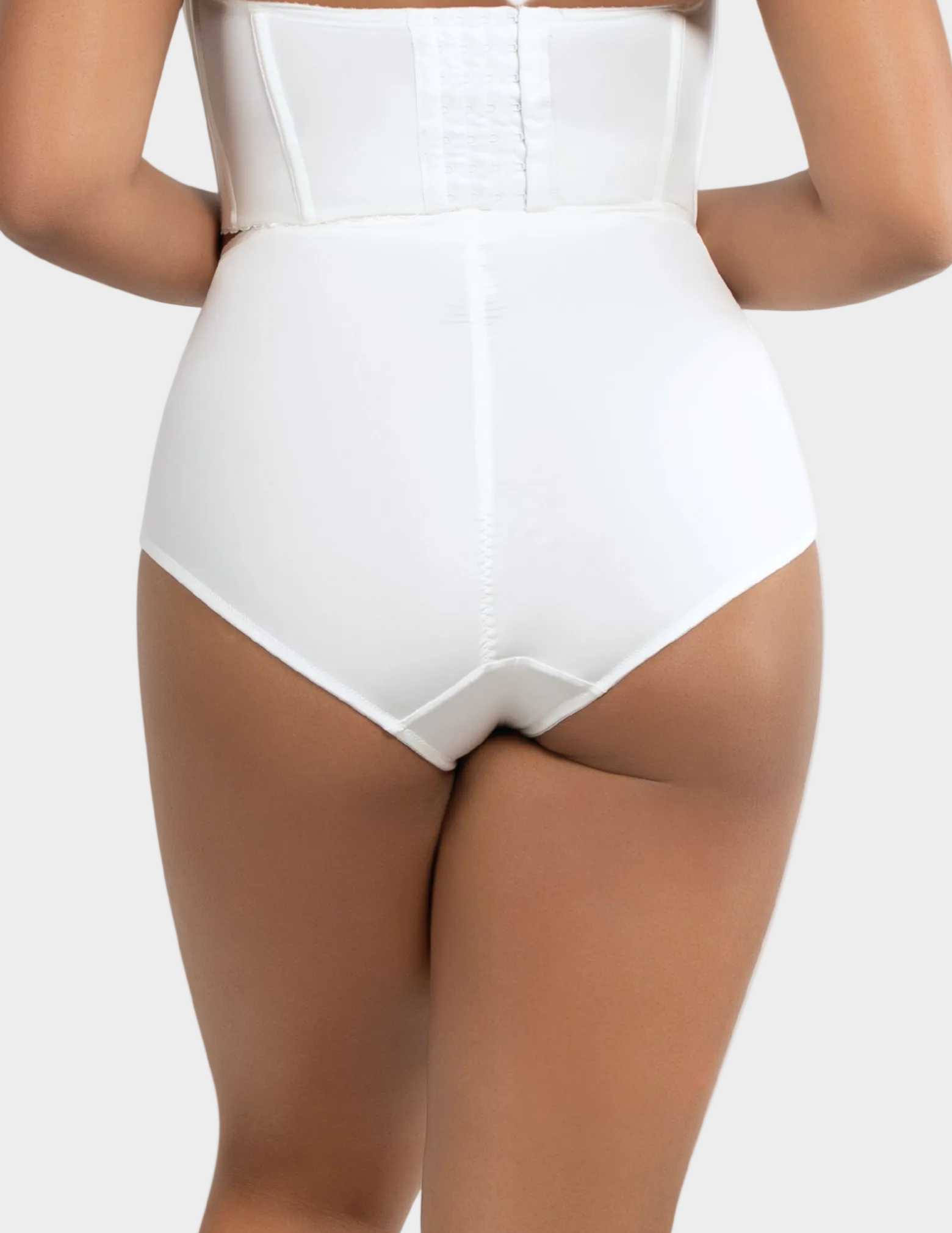 Back view of a model wearing Casey High Waisted Control Panty in Pearl White