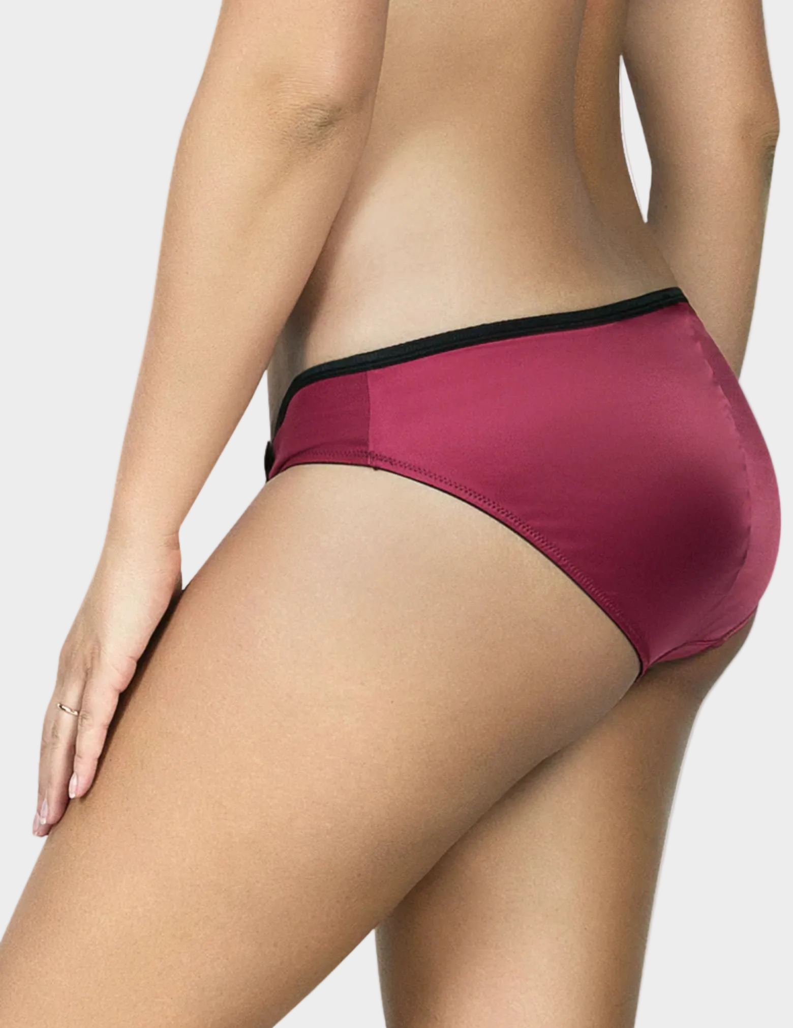 Side view of a model wearing Charlotte low rise bikini panty in Rio Red