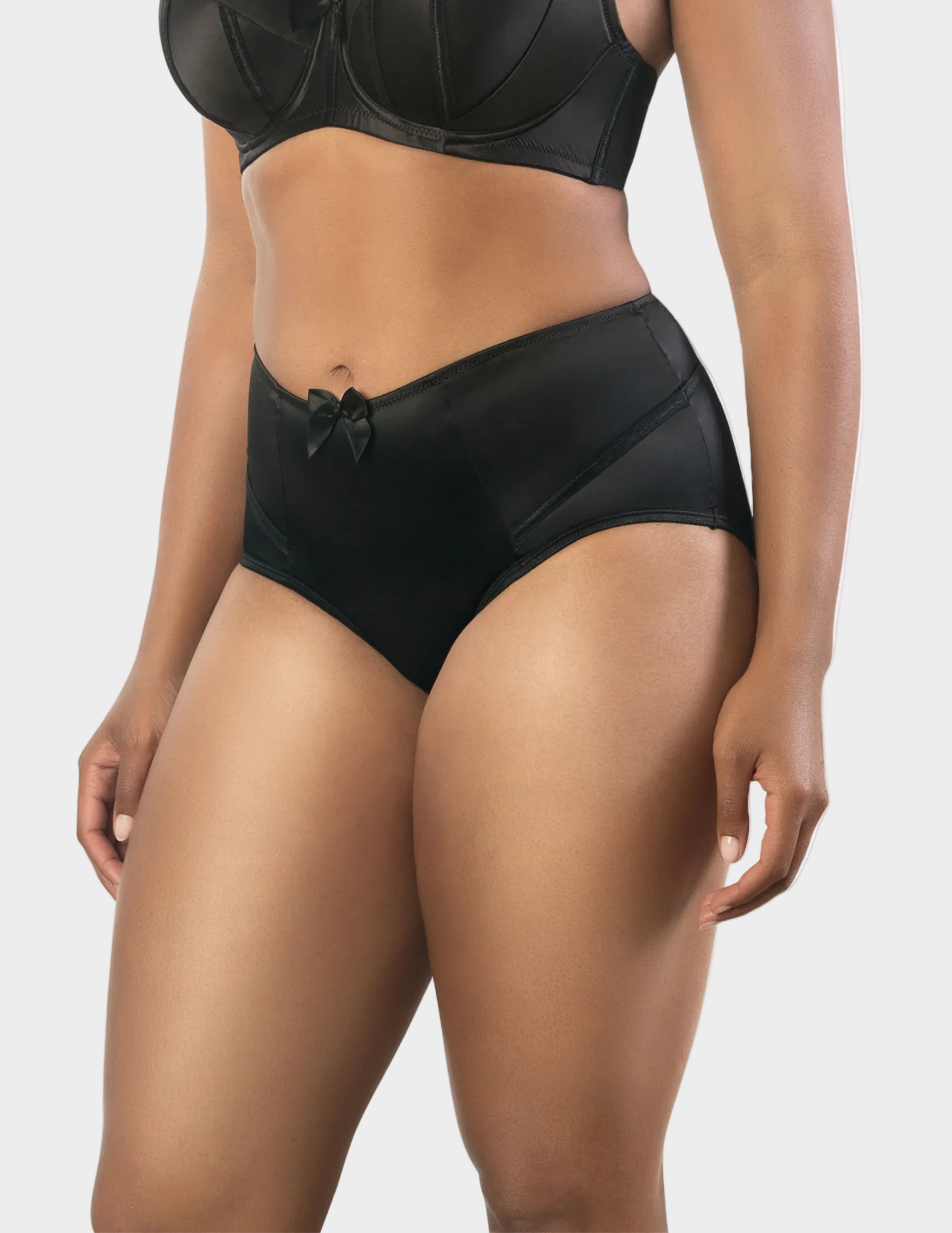 Side view of a model wearing Charlotte high waisted panty in Black