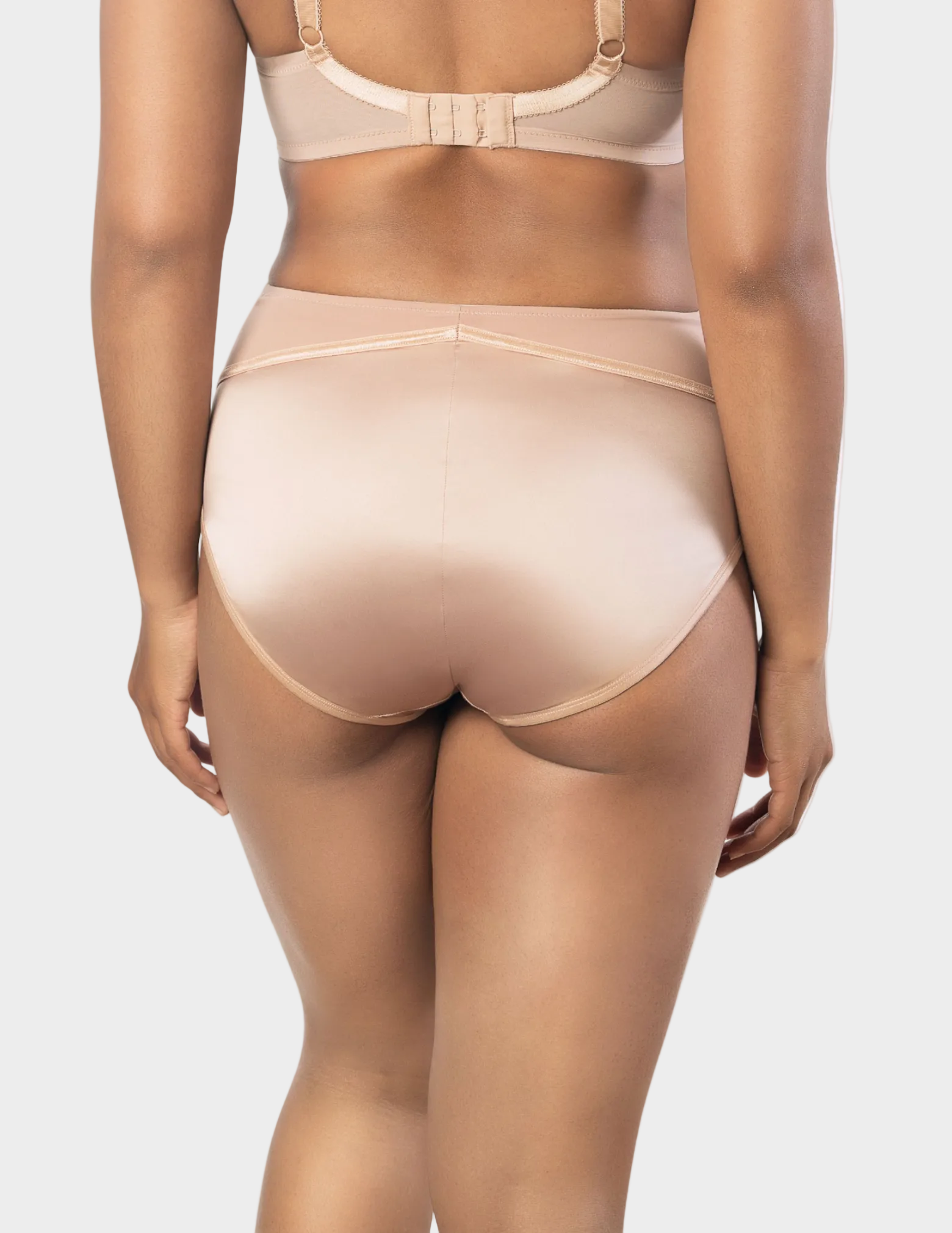 Back view of a model wearing Charlotte high waisted panty in True Nude