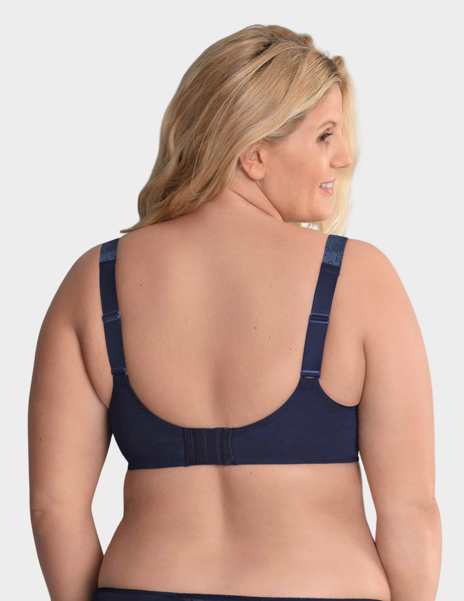 Woman wearing a navy blue bra on a white background