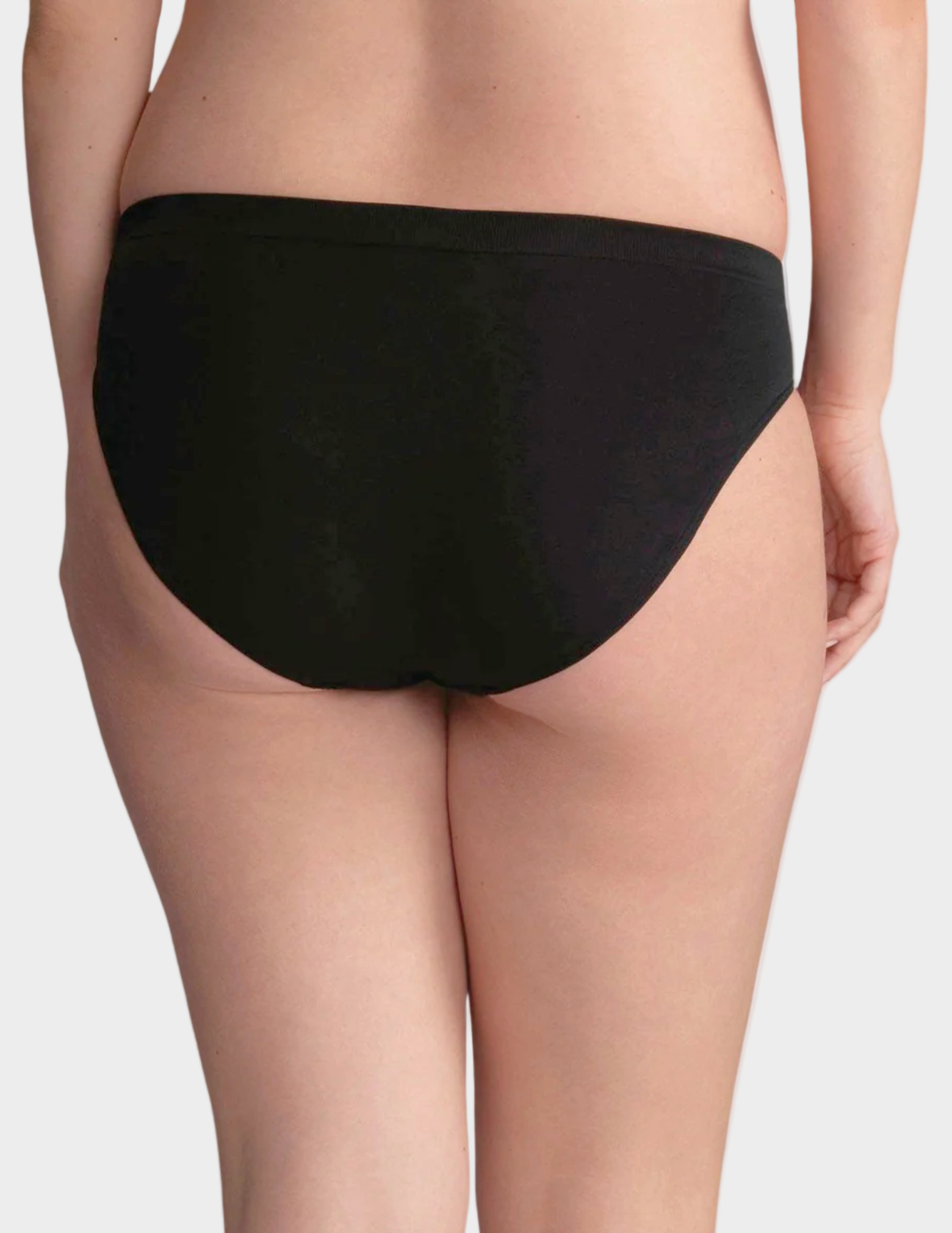 Black underwear worn by a person on a white background