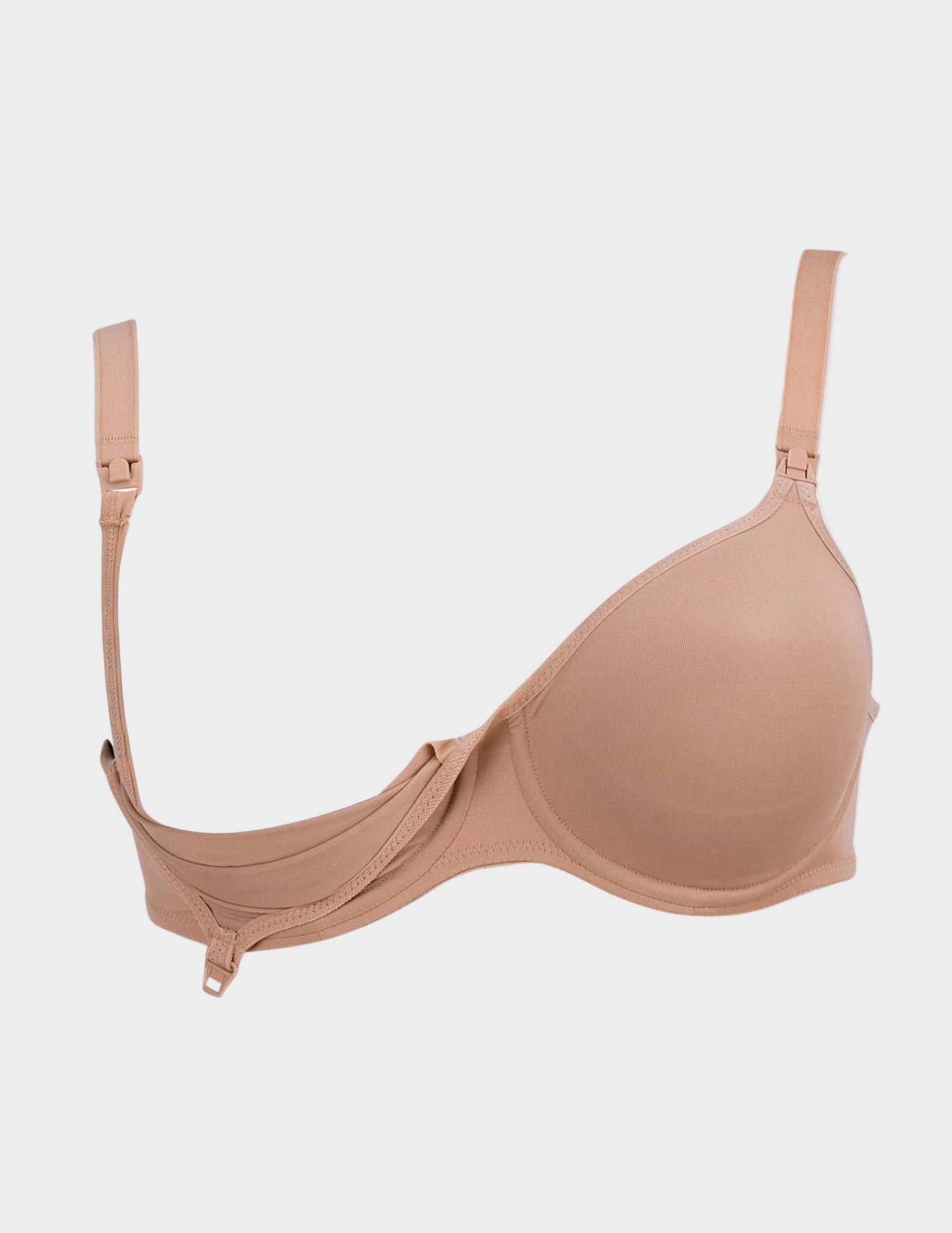 Beige nursing bra unclipped on a white background
