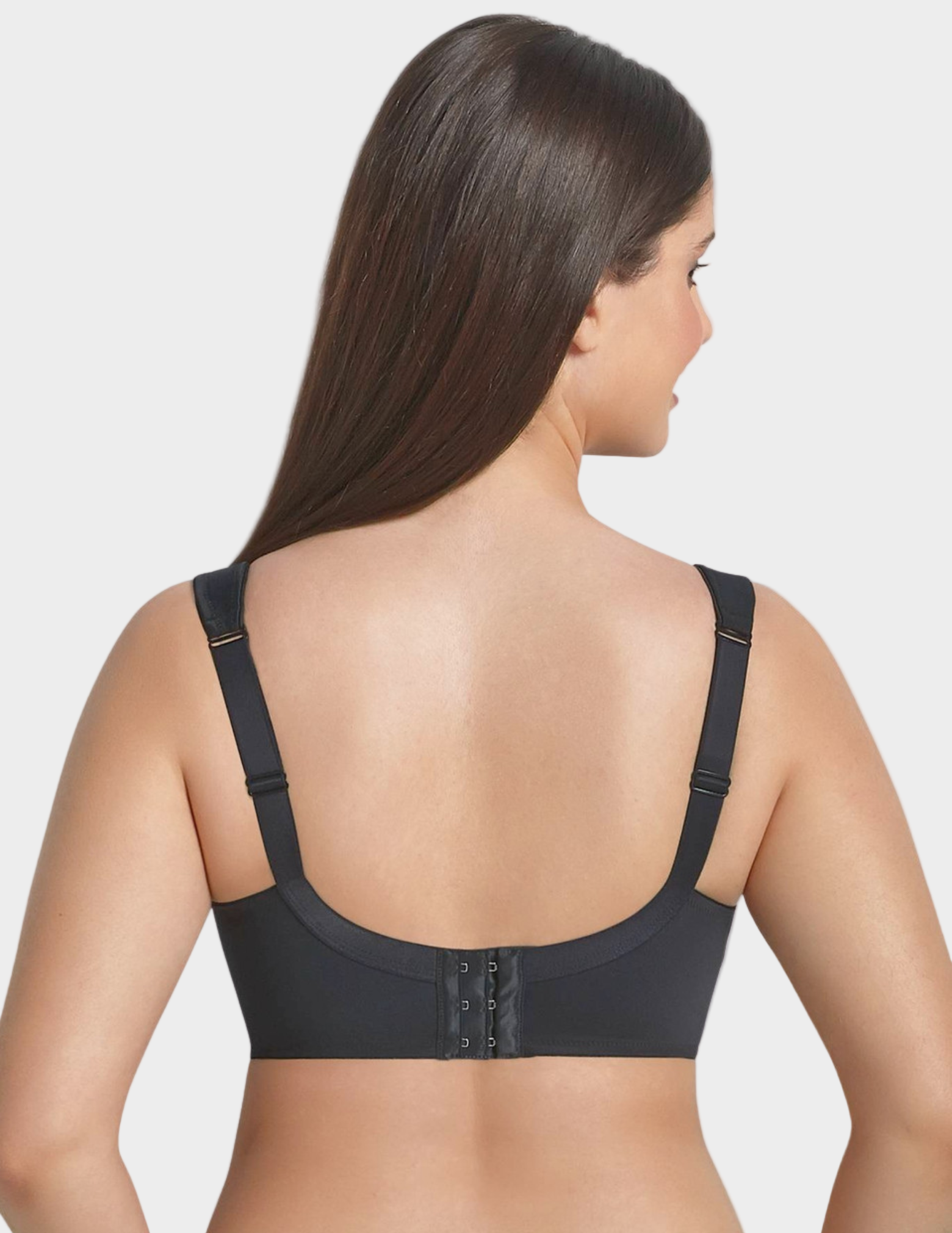 back view of woman wearing black bra on white background