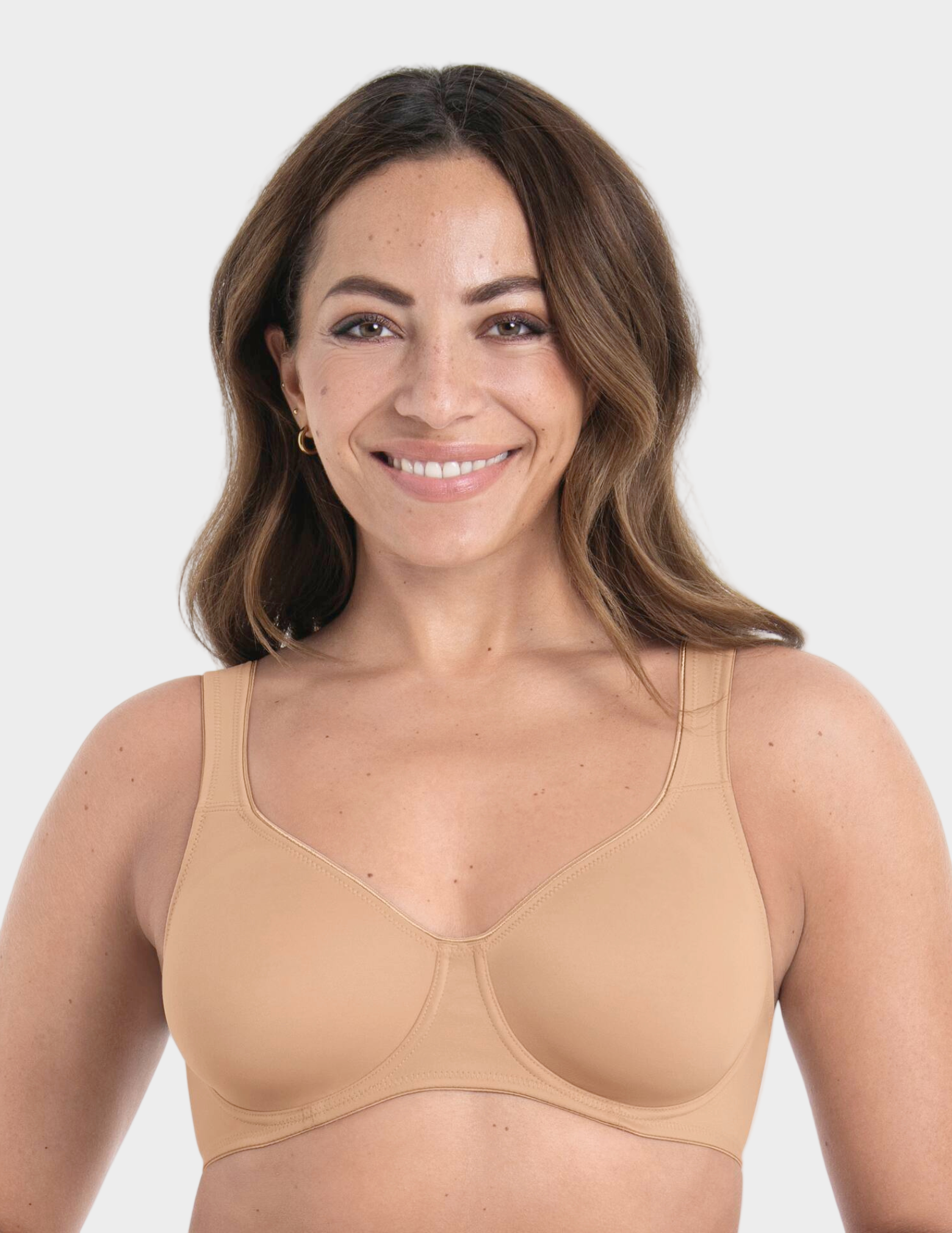 Woman wearing a beige bra on a white background