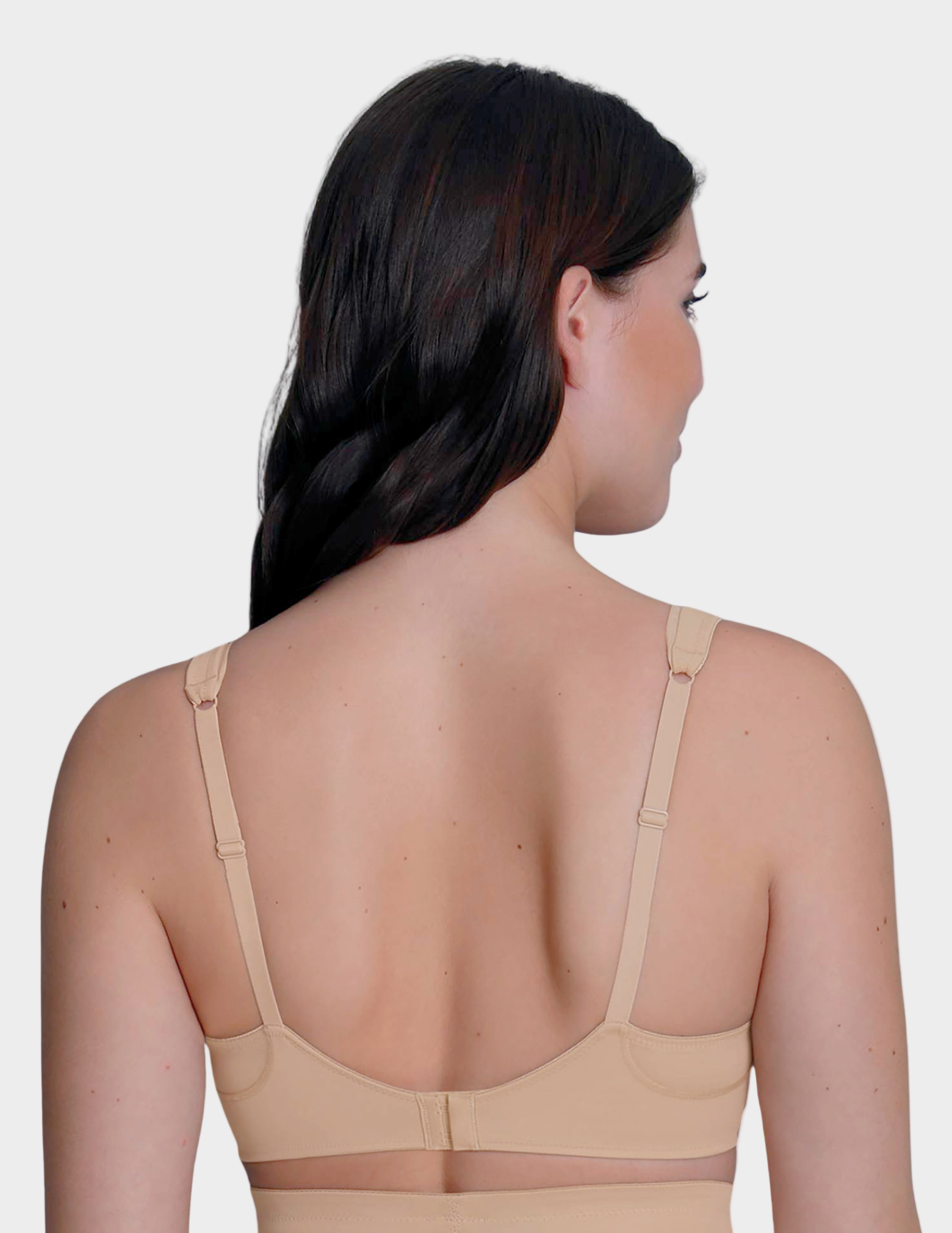 back view of Woman wearing a beige bra on a white background