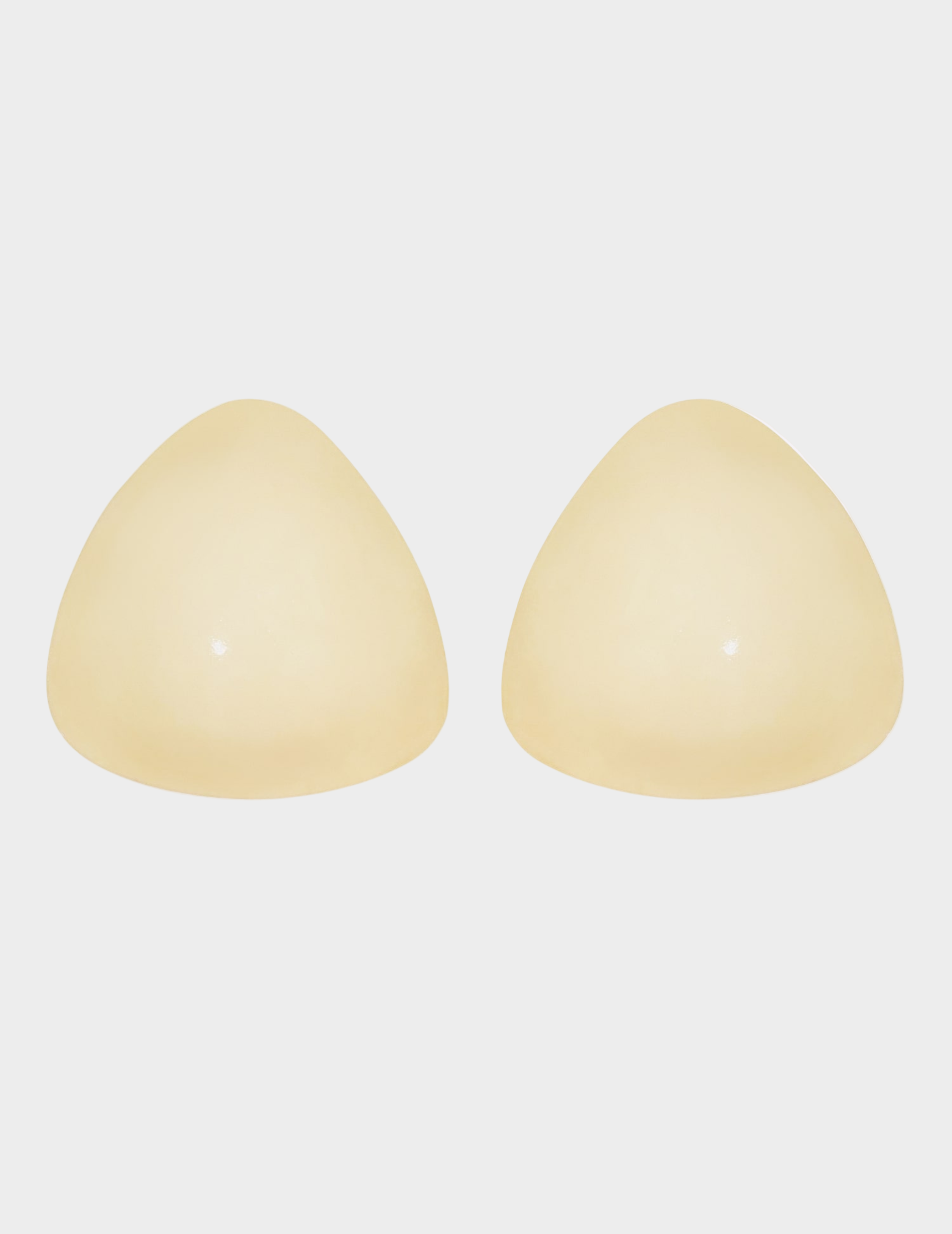 pair of light beige ultra boost inserts on white background